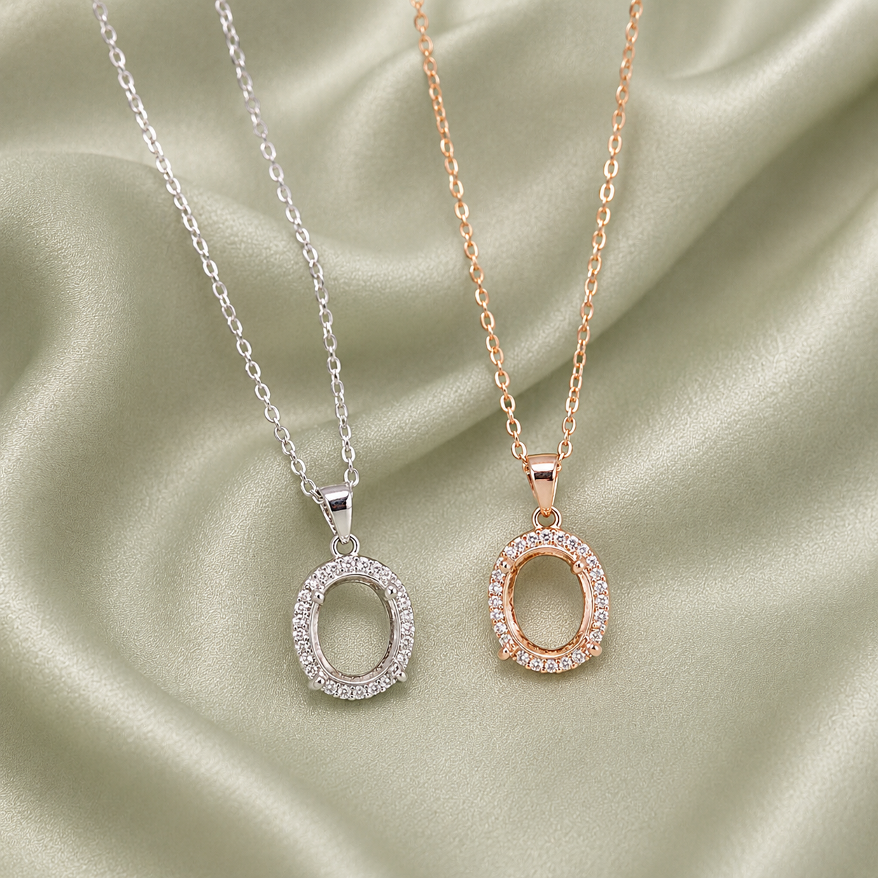 Silver and rose gold 925 sterling silver halo oval necklace settings side by side on sage green satin
