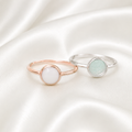 925 sterling silver round ring settings in rose gold and silver with stone on white satin