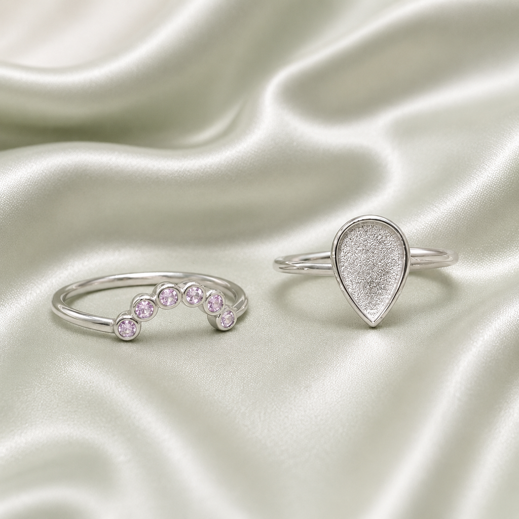 925 Sterling Silver teardrop blank ring set with pink bezel-set birthstone stacker band on sage satin