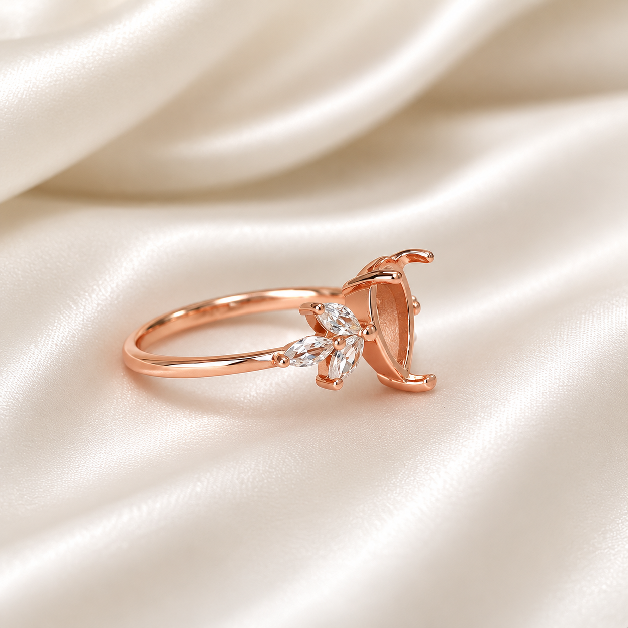 Rose gold 925 sterling silver pear prong ring setting with marquise CZ leaf accents on cream satin