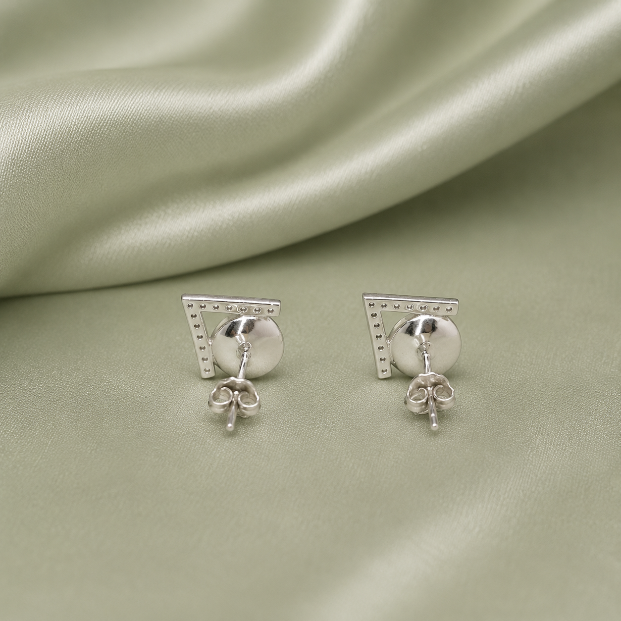 925 Sterling Silver V shape vintage stud earring settings showing butterfly back closure on sage satin - back view