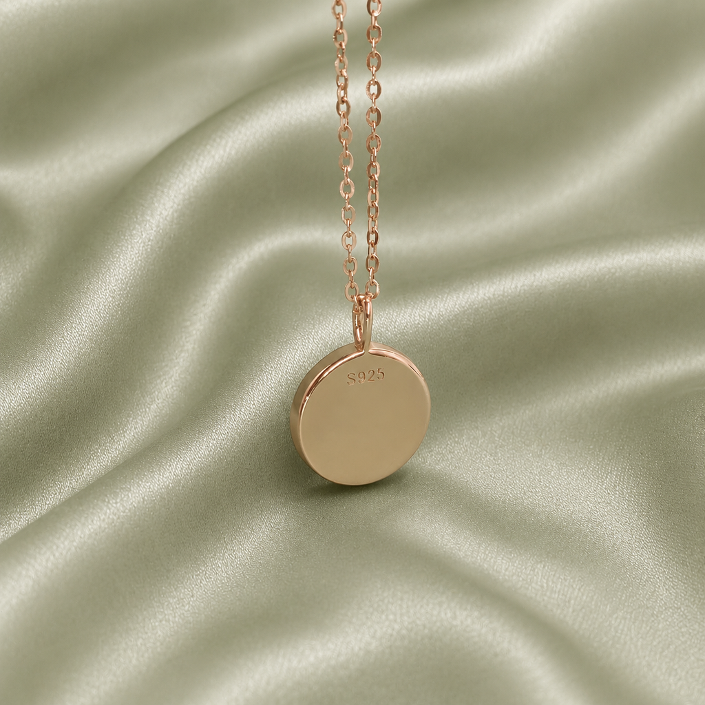 Back of rose gold 925 sterling silver round blank necklace pendant showing S925 hallmark stamp