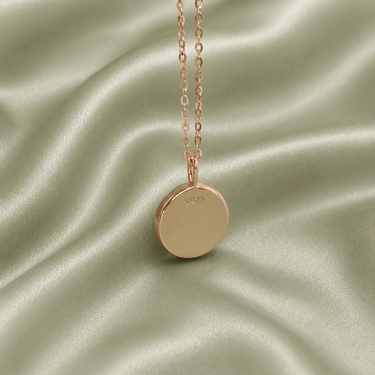 Back of rose gold 925 sterling silver round blank necklace pendant showing S925 hallmark stamp