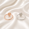 925 sterling silver heart ring settings in rose gold and silver on white satin