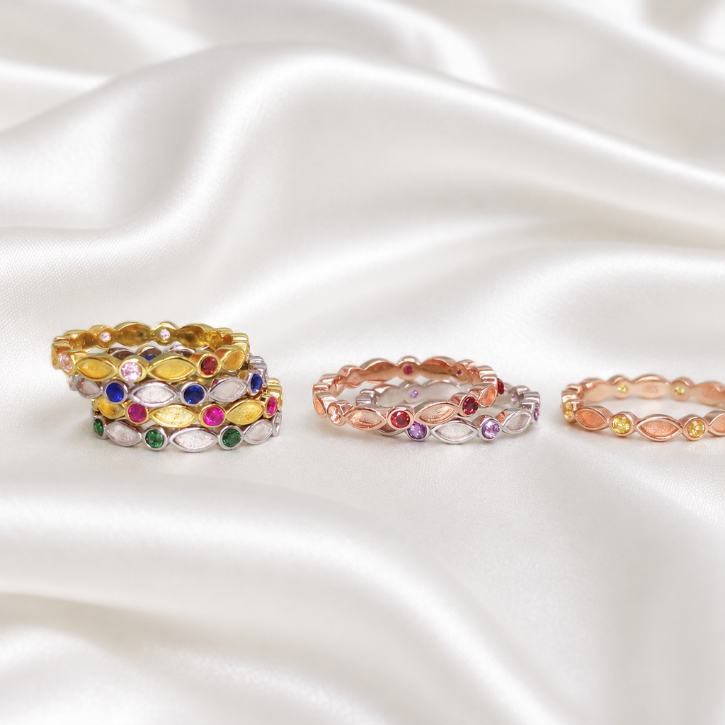 Multiple birthstone stackable ring settings in gold, rose gold and silver tones showing alternating marquise and round CZ bezels