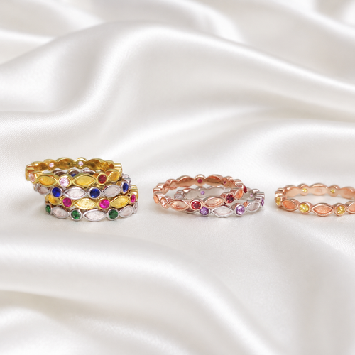 Multiple birthstone stackable ring settings in gold, rose gold and silver tones showing alternating marquise and round CZ bezels