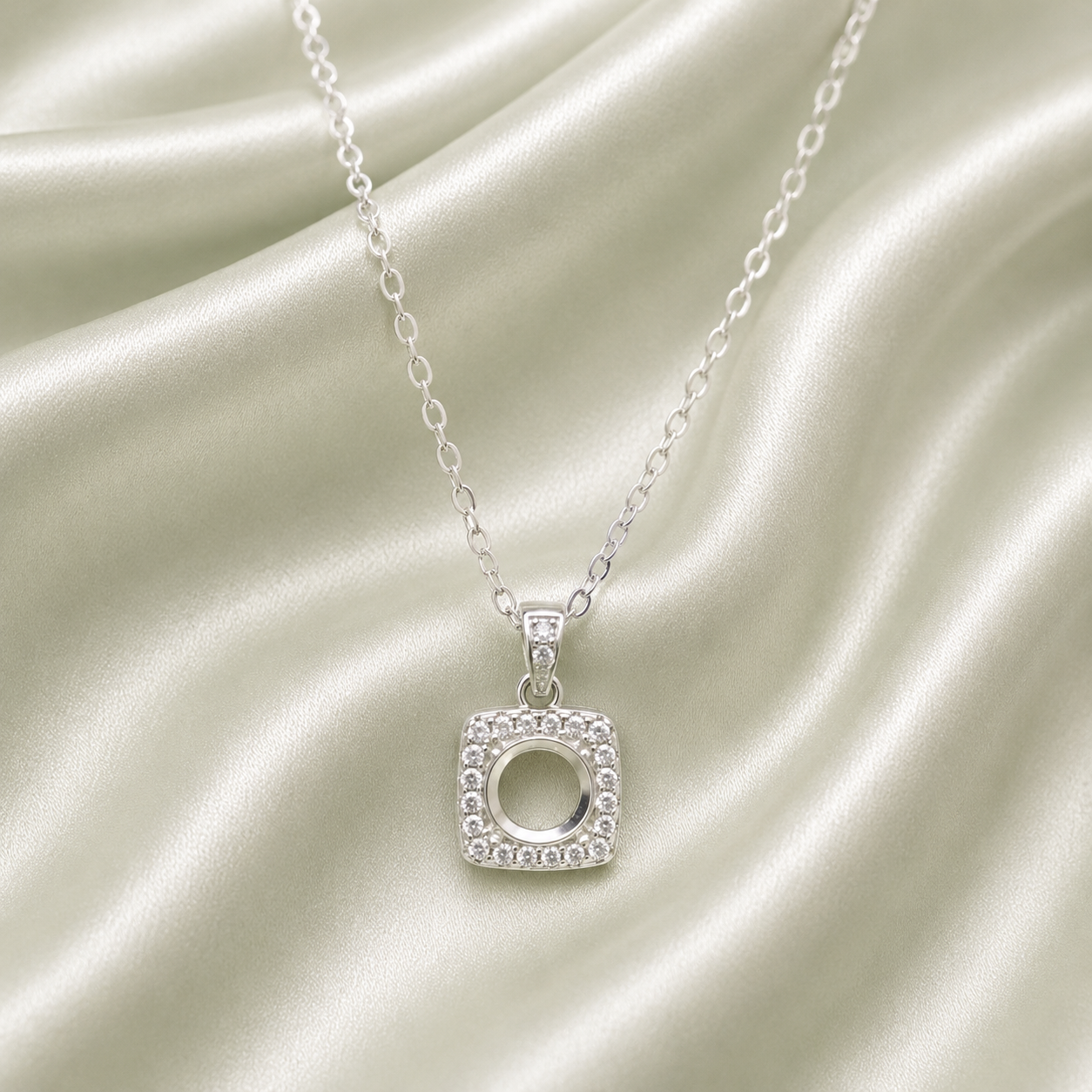 925 Sterling Silver Square Cushion Halo Blank Necklace Setting – open round center with CZ border on sage green background