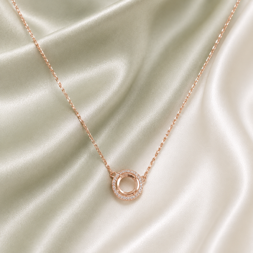 6.5MM Luxury Round CZ Prong Blank Necklace Setting – Rose Gold dainty halo on cream satin background